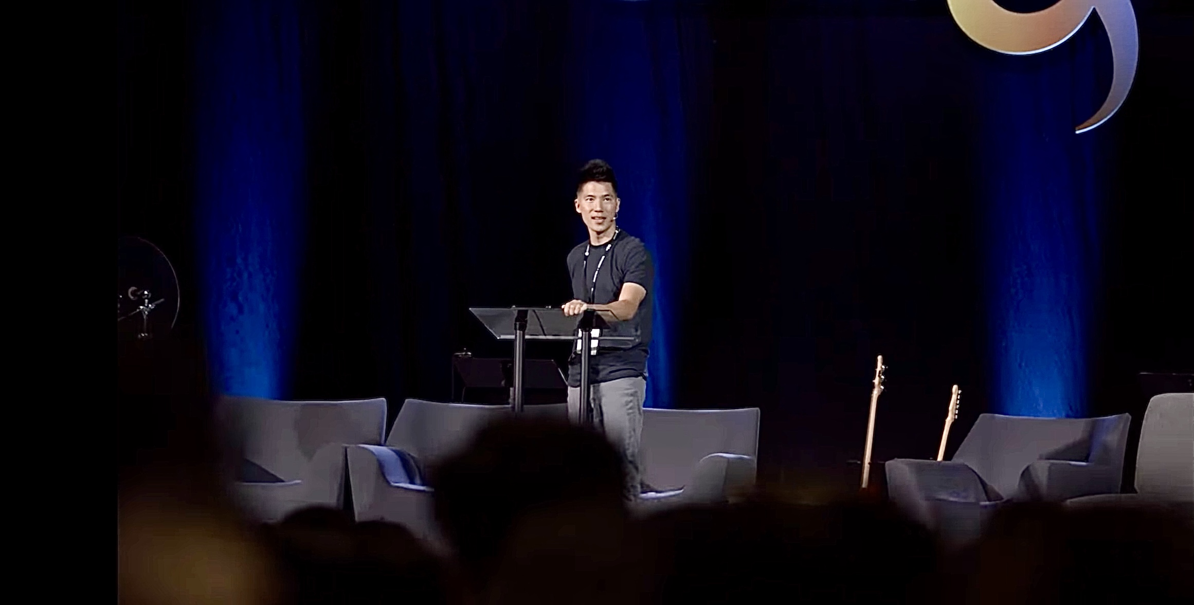 Dr. Jin Taek Chung speaking at a podium