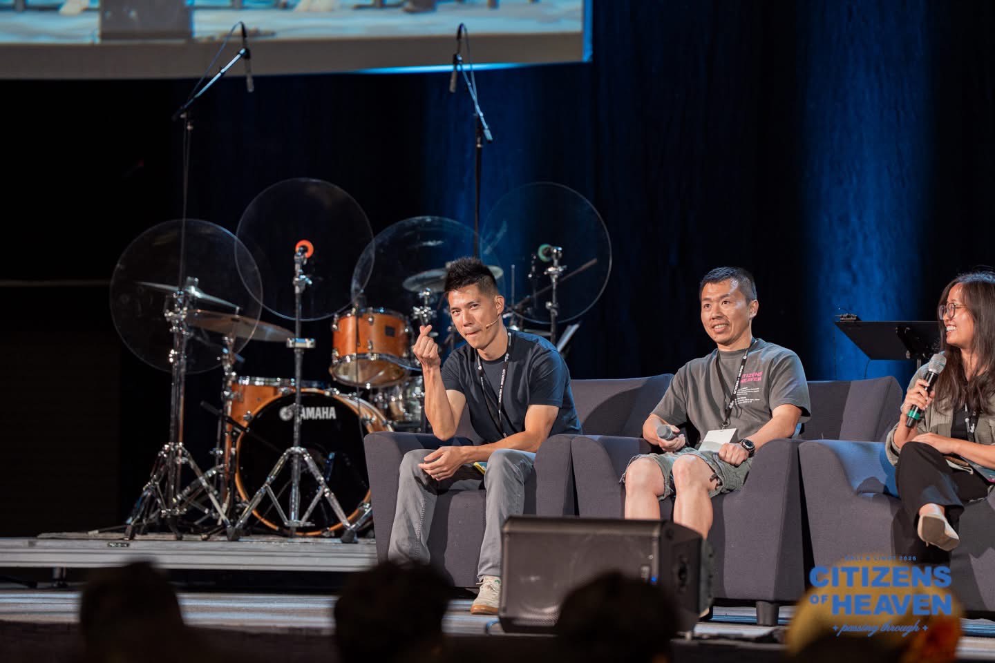 Dr. Chung speaking from a podium on stage